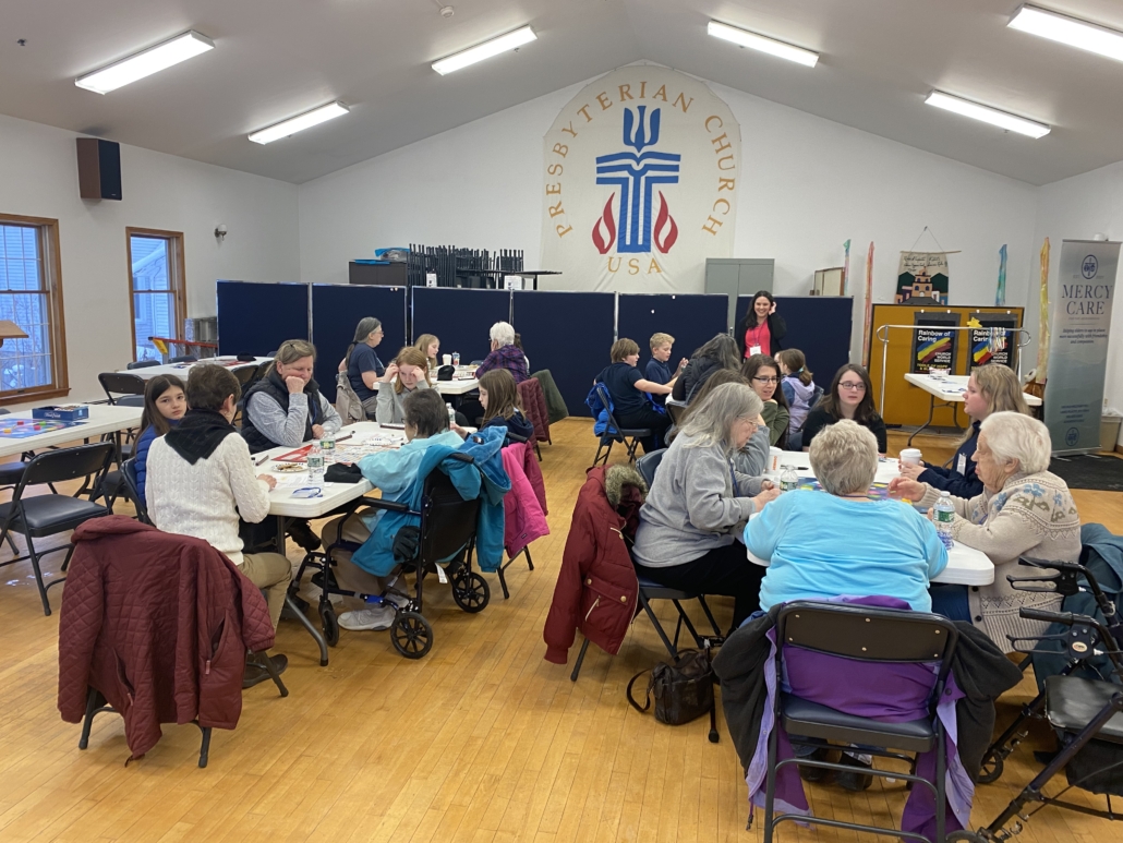 Gathering of a group of local community members of all ages working together